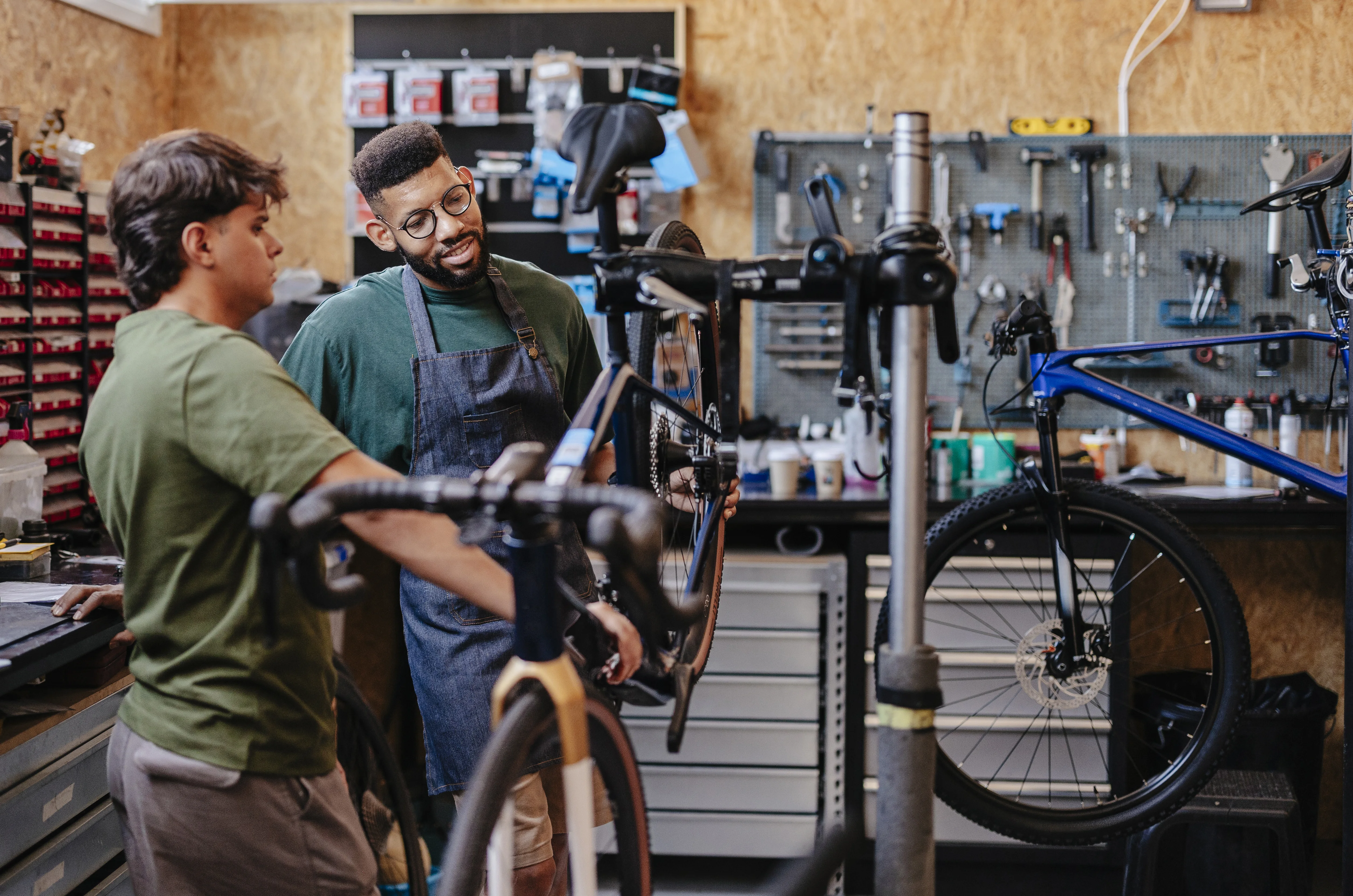 Bicycle mechanics working on repairs in the workshop