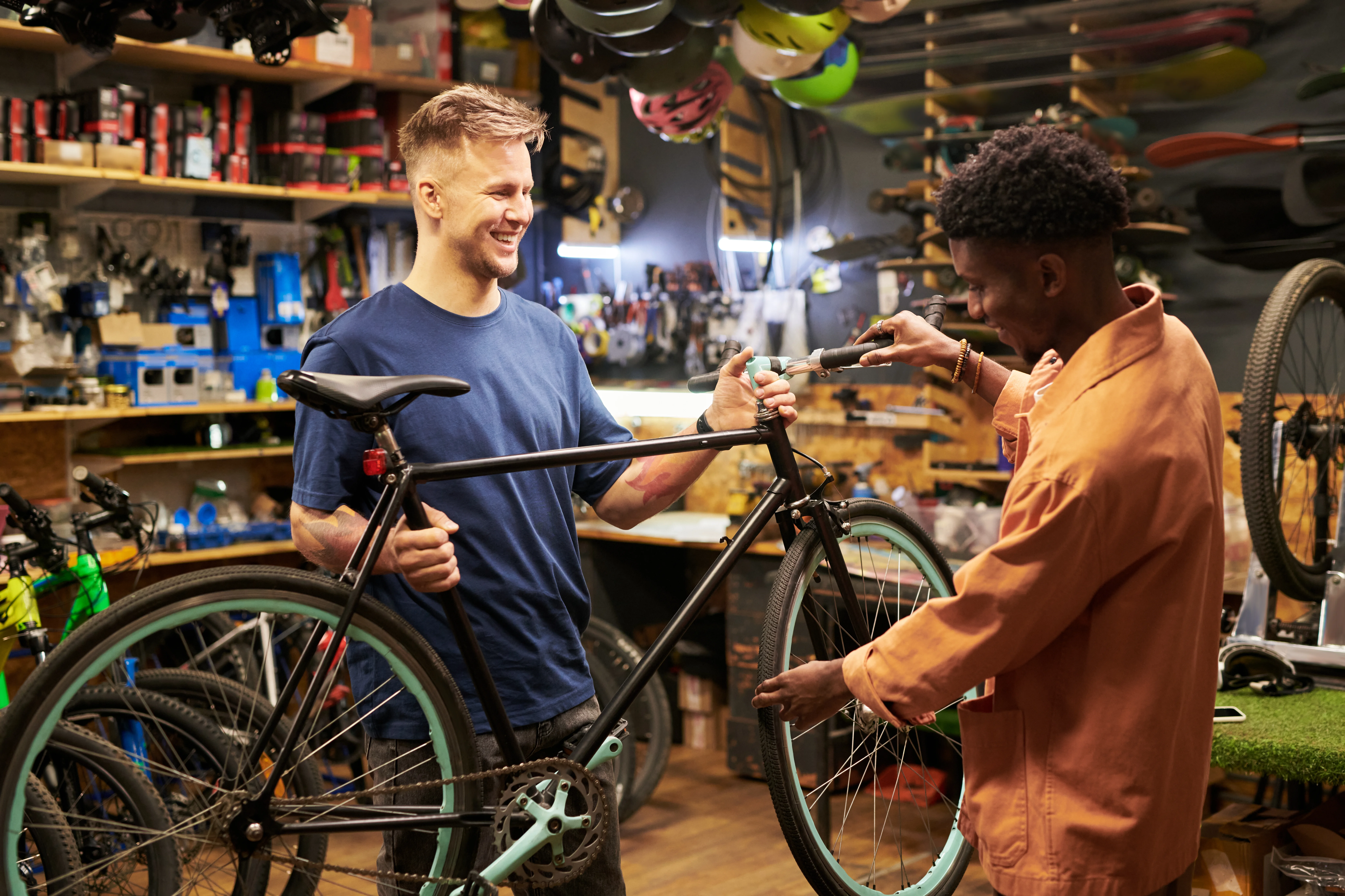 Two people inspecting a bike together in the shop